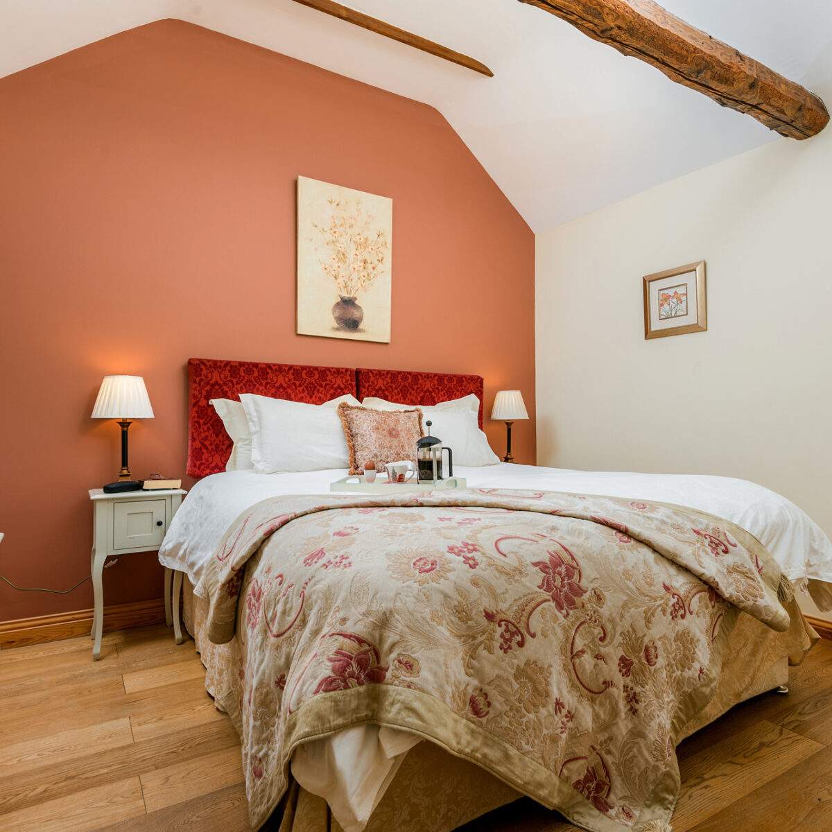 superking bed in a bedroom with vaulted ceiling 