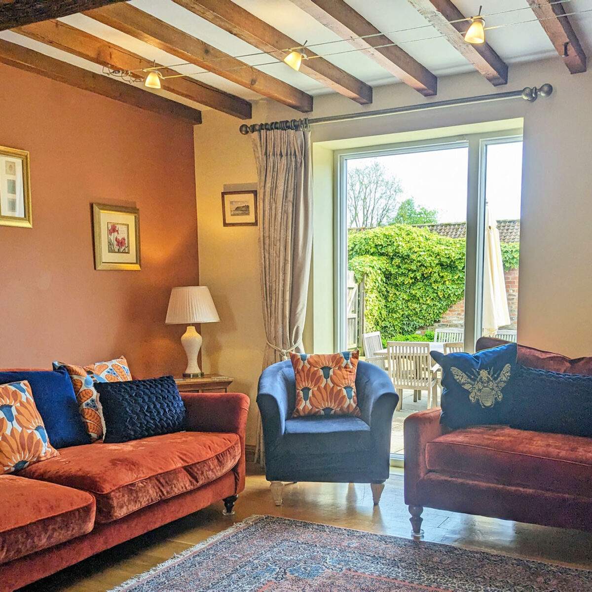 Barn-onto-courtyard-3 sitting room with large window looking onto a garden
