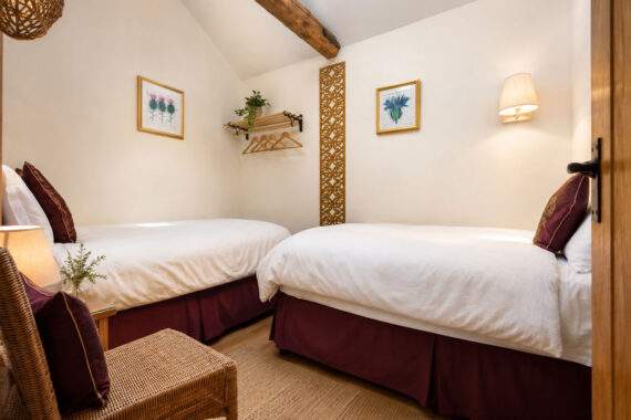 small cosy bedroom with two single beds 