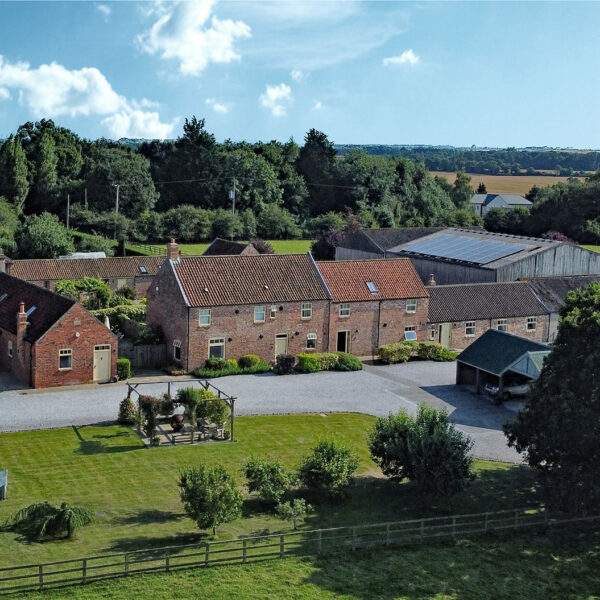 aerial view of cottages on a farm