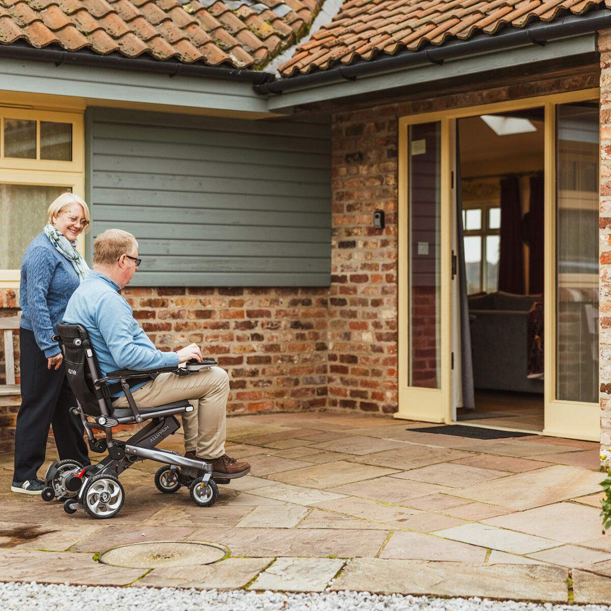 Broadgate_Farm_Cottages_139 Man in wheelchair and lady entering the Cart House at Broadgate Farm Cottages