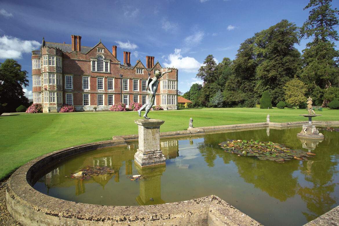 brick hall in the background a pond in the foreground
