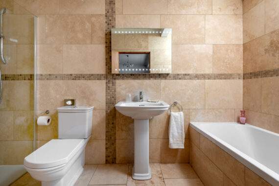 bathroom with shower and bath 