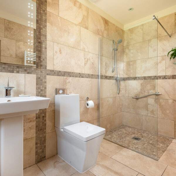 walk in shower in fully tiled ensuite 