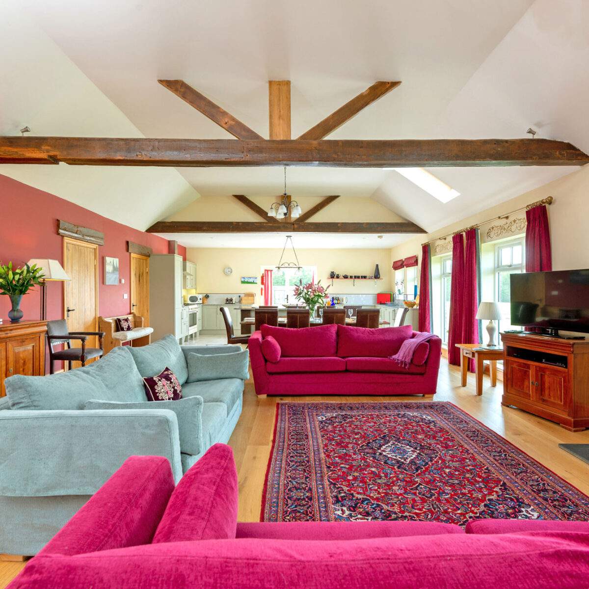 cart house living room with sofas, dining area and kitchen 