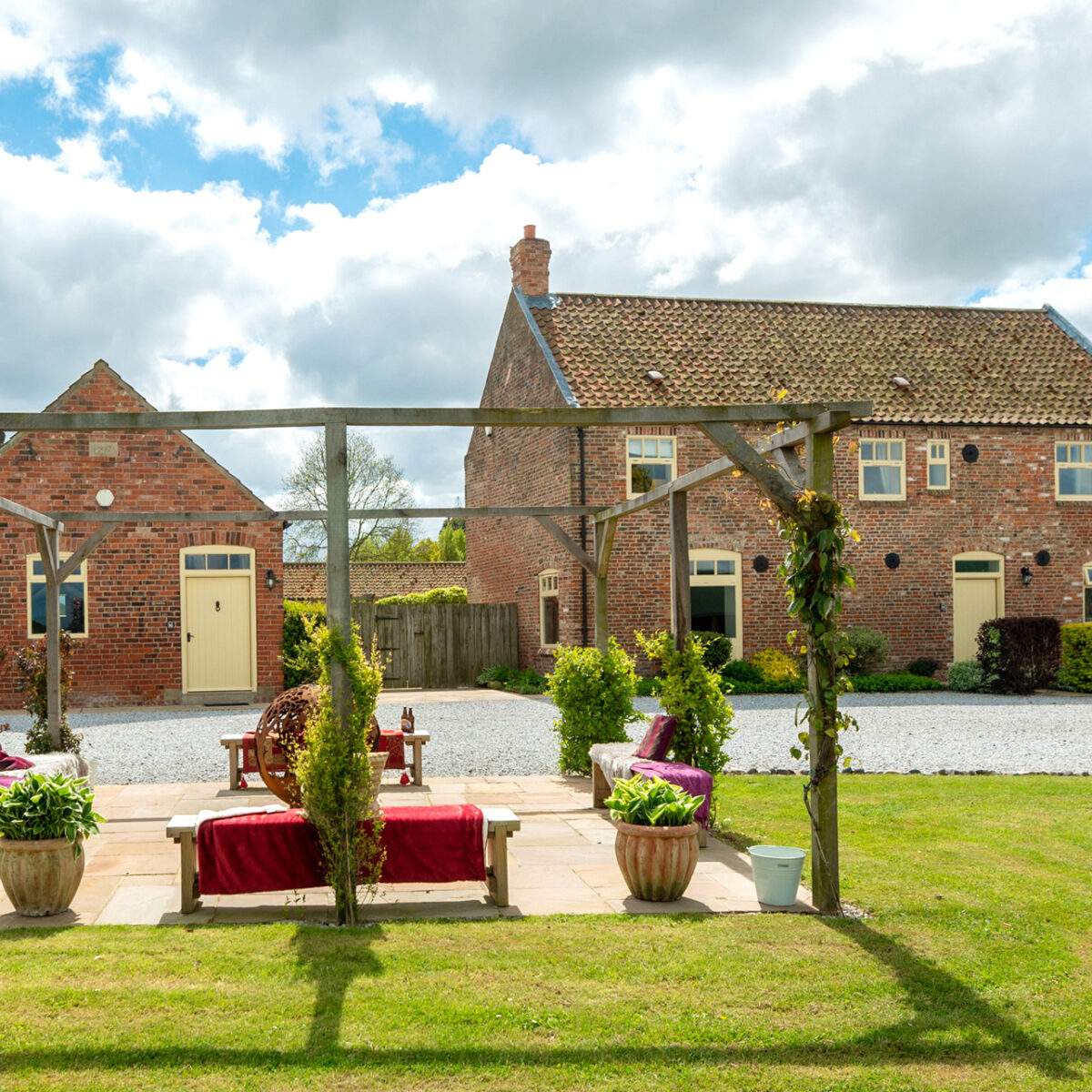 The fireball area at Broadgate Farm Cottages with the Stables and the Granary in the background 