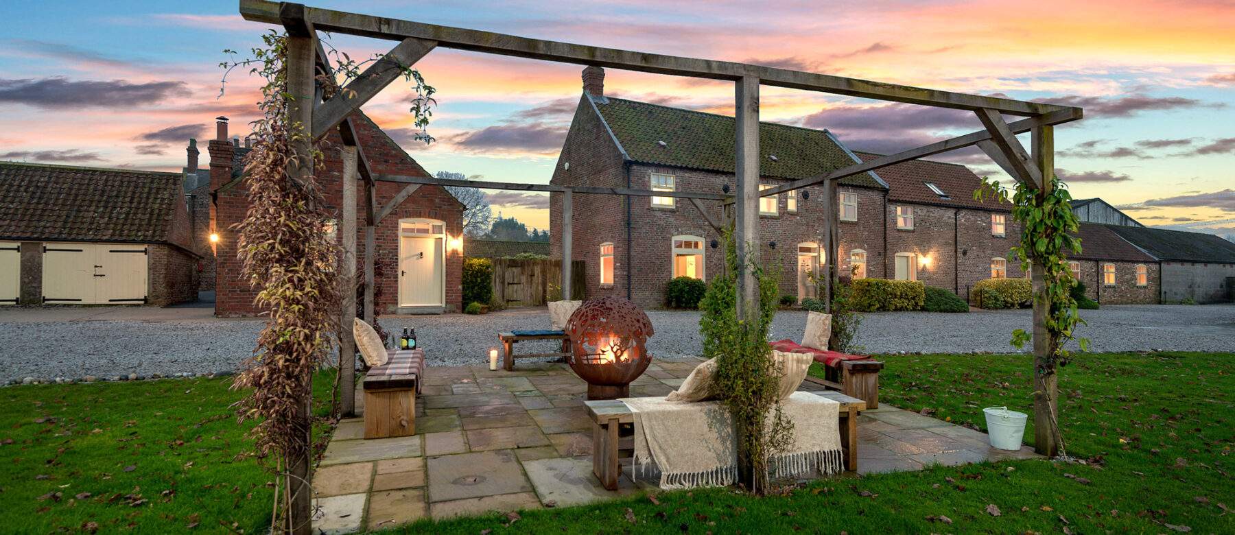 fireball lit on a night with cottages in the background