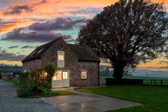the outside of Forge cottages at dusk 