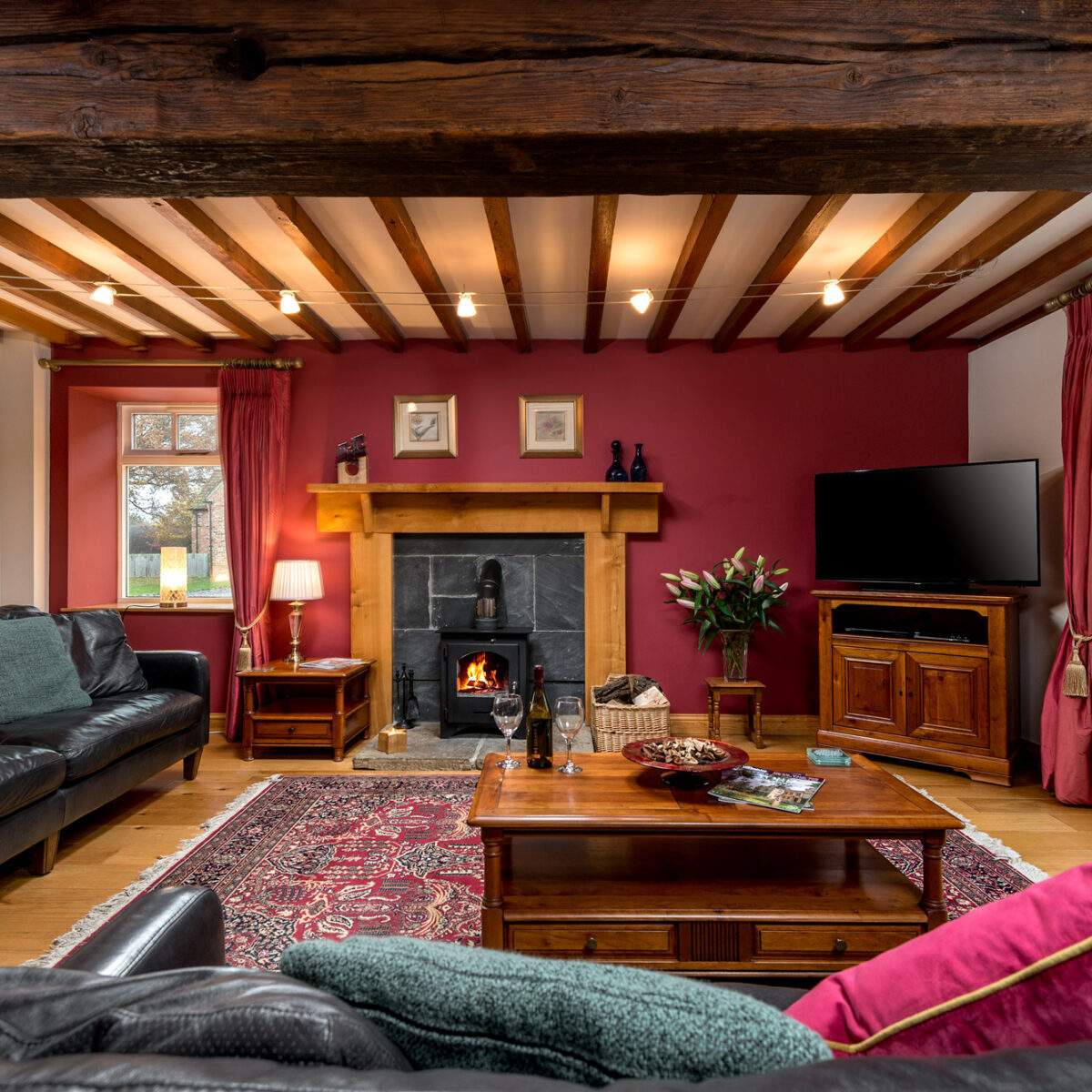 beamed sitting room with log burner 