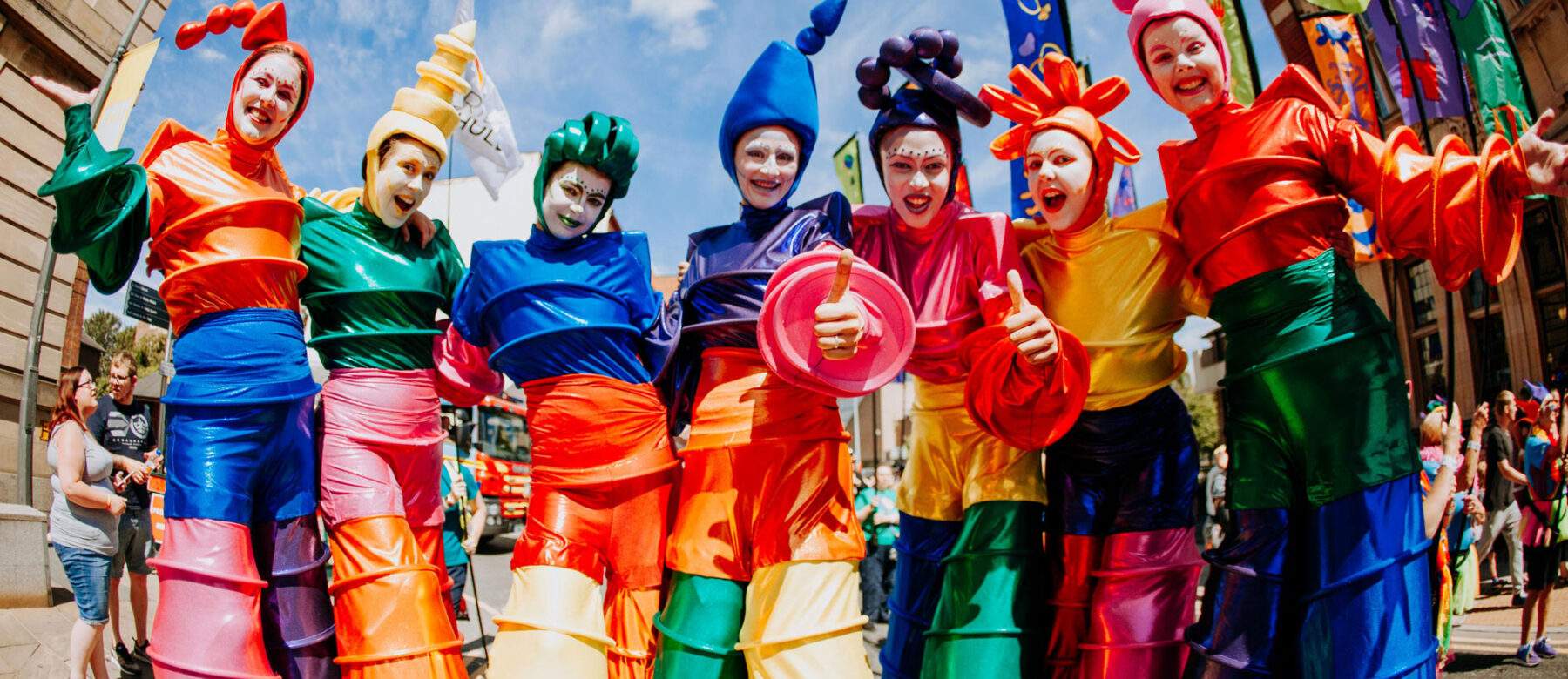 colourful stilt walkers