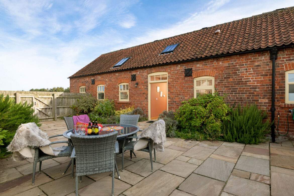 Private and fully enclosed courtyard garden with garden furniture