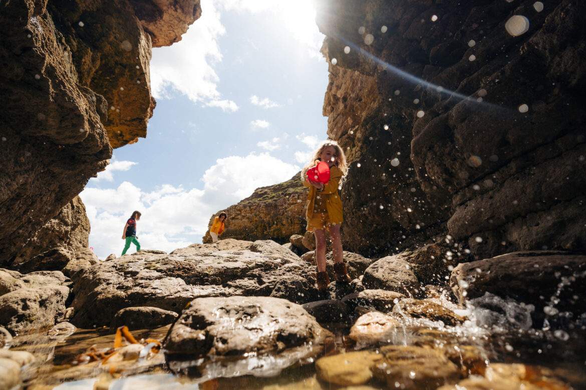 children playing near rockpools