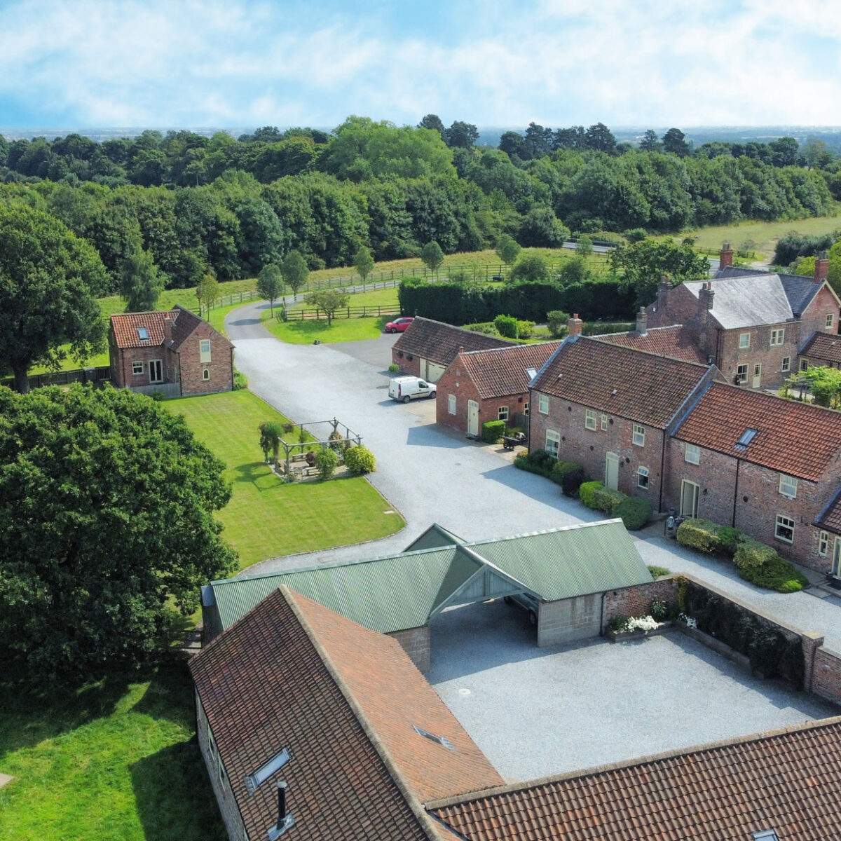 july-24-aerial-crop aerial view from the west of the holiday cottages