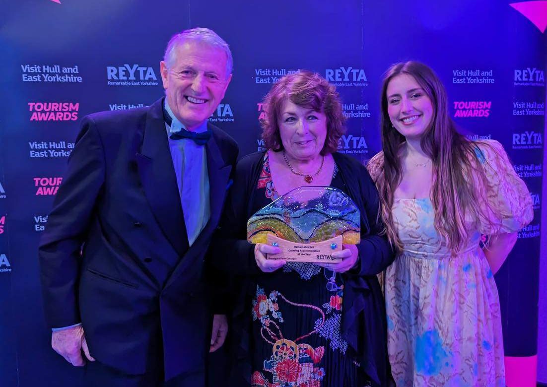 Elaine, Steve and Lauren standing together after winning the Remarkable Self Catering Accommodation award 2023