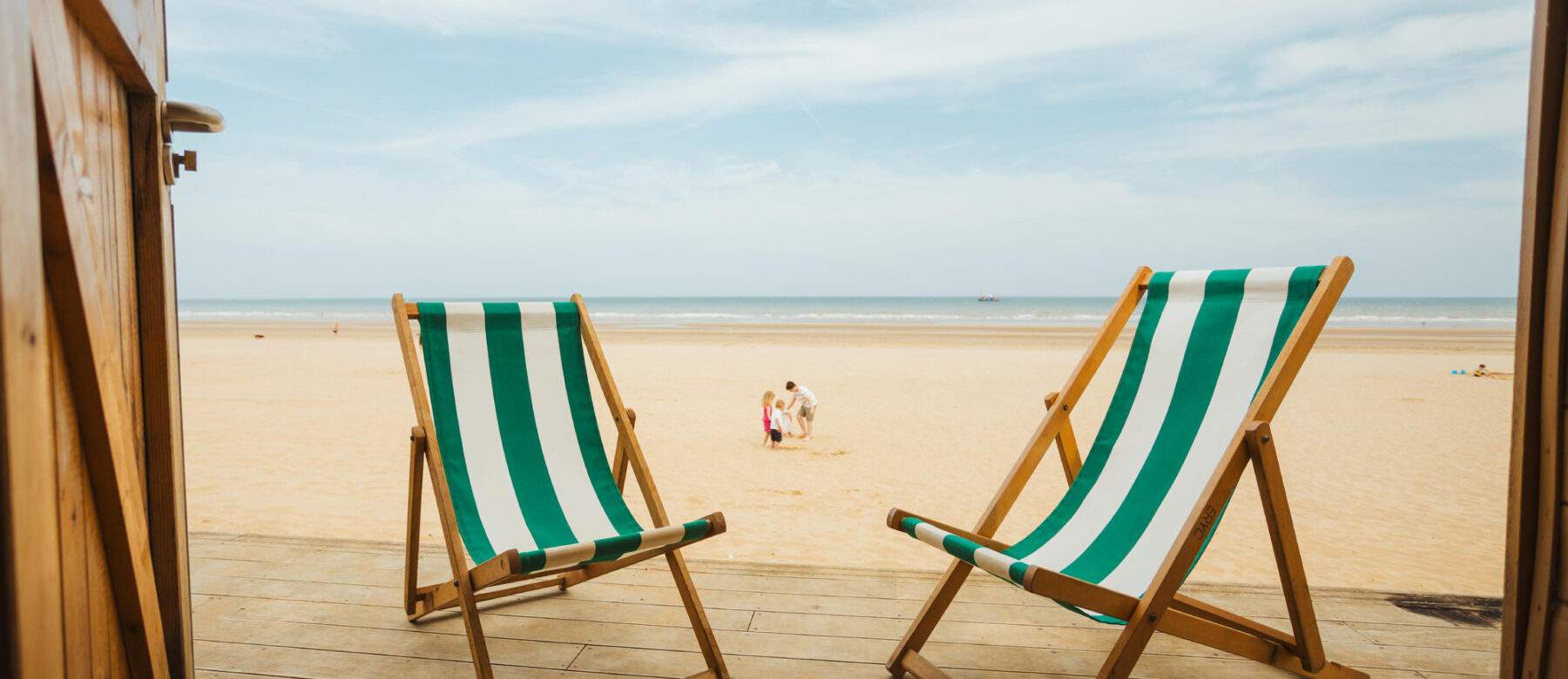 deckchairs outside a beach hut