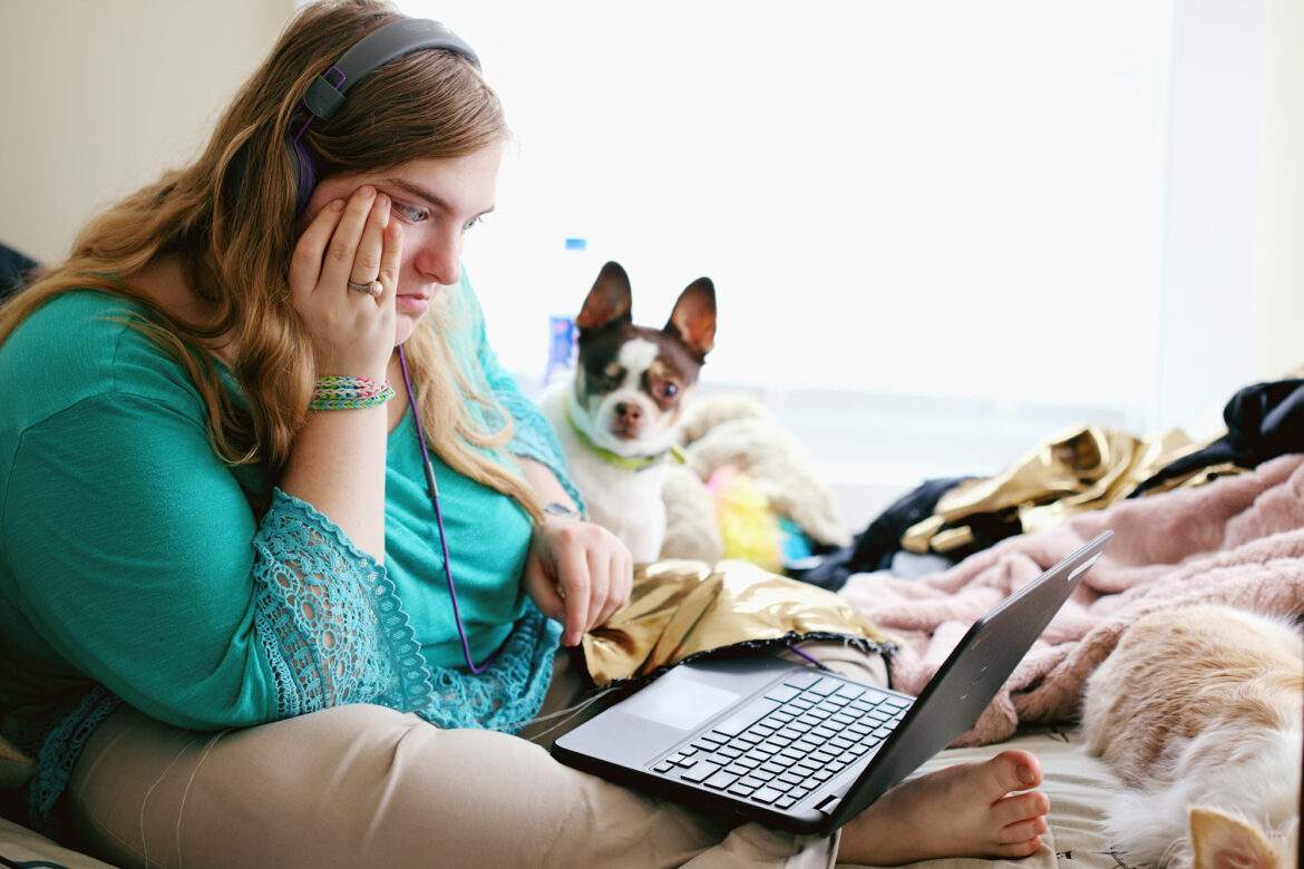 young woman on laptop - alexander grey unsplash